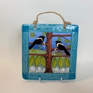 A handmade earthenware hanging picture tile. This tile design came from the traditional “Magpie Rhyme” One for sorrow, Two for Joy. 